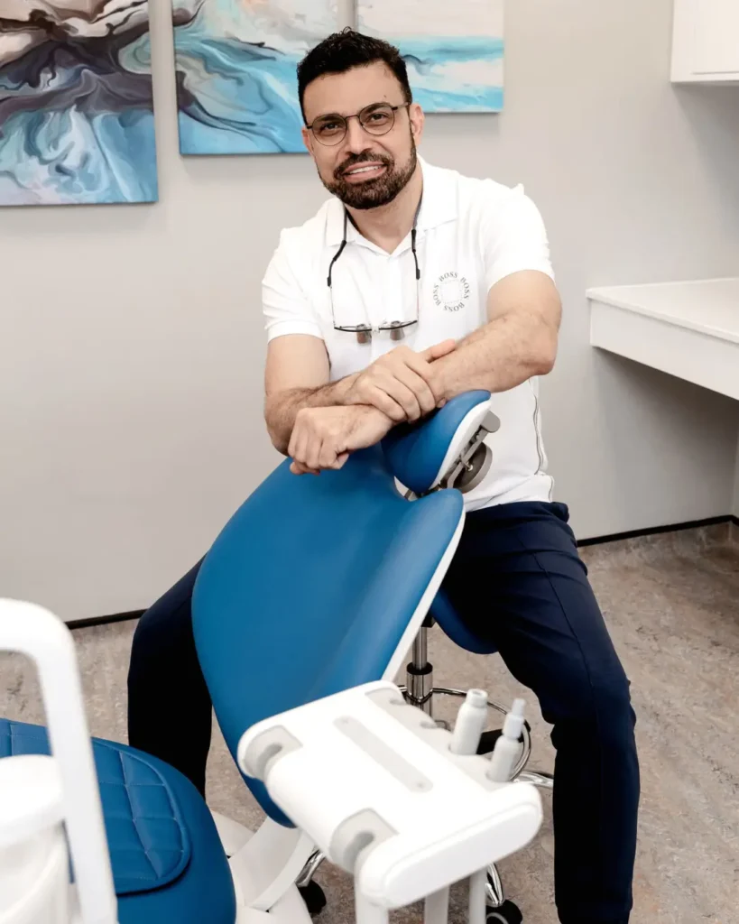 Dr. Mustafa sitting in his Orthodontic Clinics